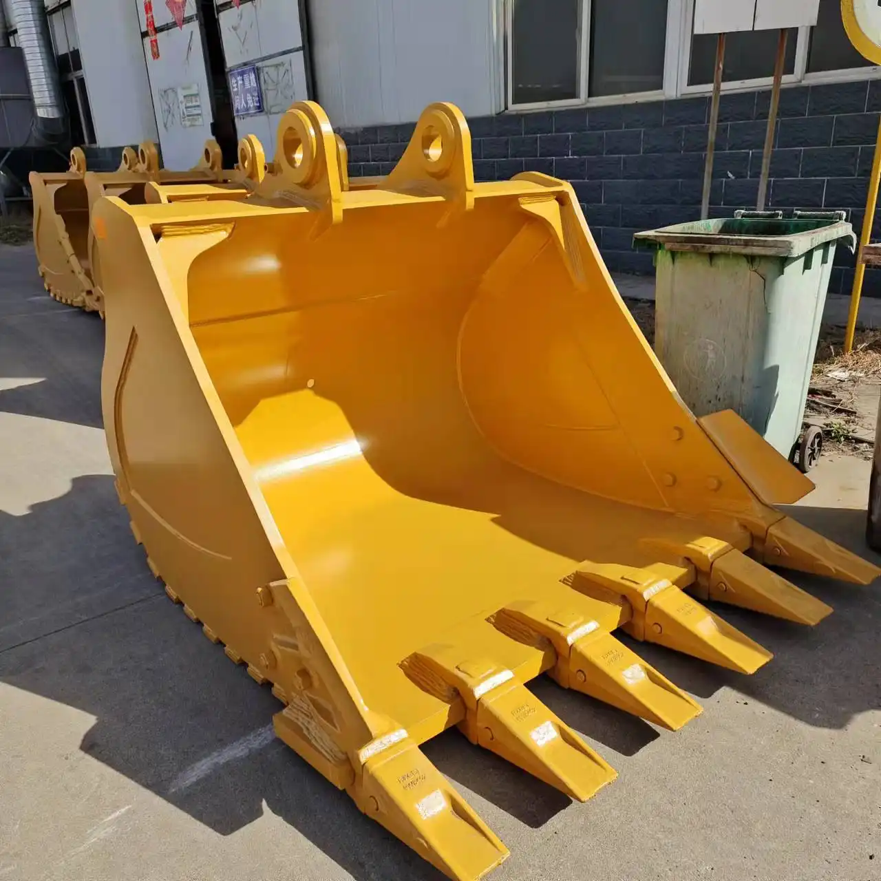 What type of steel are excavator buckets made of?
